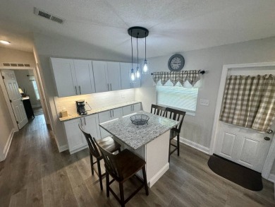 This beautifully remodeled Palm Harbor stucco home is a on Del Tura Golf and Country Club in Florida - for sale on GolfHomes.com, golf home, golf lot