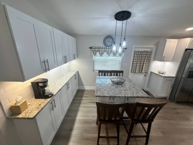 This beautifully remodeled Palm Harbor stucco home is a on Del Tura Golf and Country Club in Florida - for sale on GolfHomes.com, golf home, golf lot