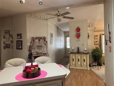 Welcome to Zellwood Station! This 2-bedroom, 2-bath home boasts on Zellwood Station Country Club in Florida - for sale on GolfHomes.com, golf home, golf lot