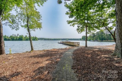 Fabulous lakefront home featuring incredible sunrise views of on Old North State Club at Uwharrie Point Golf community in North Carolina - for sale on GolfHomes.com, golf home, golf lot