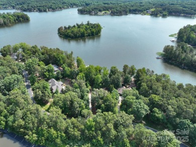 Fabulous lakefront home featuring incredible sunrise views of on Old North State Club at Uwharrie Point Golf community in North Carolina - for sale on GolfHomes.com, golf home, golf lot