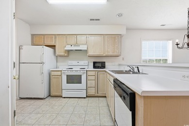 Welcome to this 2-bedroom, 2-bathroom first-floor condo located on River Oaks Golf Plantation  in South Carolina - for sale on GolfHomes.com, golf home, golf lot