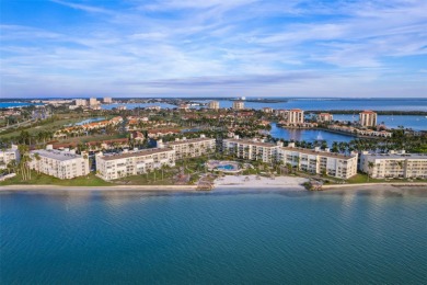 Grab your slice of paradise in this immaculate Bahia Vista condo on Isla Del Sol Yacht and Country Club in Florida - for sale on GolfHomes.com, golf home, golf lot