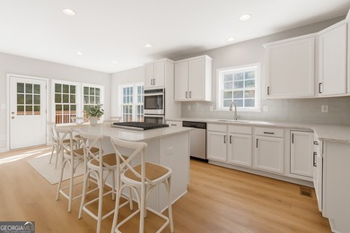 Welcome home to this stunning 3-story brick residence in the on Canongate At Heron Bay in Georgia - for sale on GolfHomes.com, golf home, golf lot