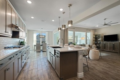 This stunning, light-filled home showcases an open-concept on Wildhorse Golf Club of Robson Ranch in Texas - for sale on GolfHomes.com, golf home, golf lot