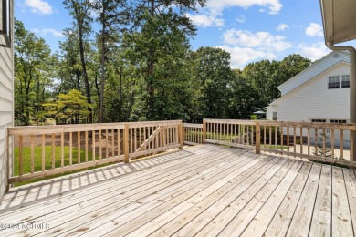 Welcome to 108 Winston Drive, an exquisite modern residence on Beacon Ridge Golf and Country Club in North Carolina - for sale on GolfHomes.com, golf home, golf lot