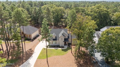 Welcome to 108 Winston Drive, an exquisite modern residence on Beacon Ridge Golf and Country Club in North Carolina - for sale on GolfHomes.com, golf home, golf lot