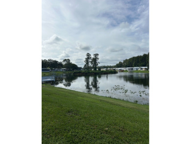 COME AND GRAB THIS DEAL OF A HOME IN THE VERY DESIRABLE ODESSA on Silver Dollar Golf and Trap Club in Florida - for sale on GolfHomes.com, golf home, golf lot