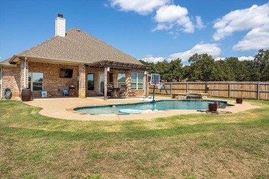 Discover the perfect blend of luxury & lifestyle in this on Pecan Plantation Country Club in Texas - for sale on GolfHomes.com, golf home, golf lot