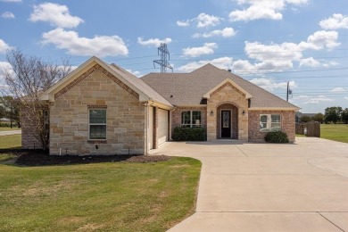 Discover the perfect blend of luxury & lifestyle in this on Pecan Plantation Country Club in Texas - for sale on GolfHomes.com, golf home, golf lot