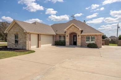 Discover the perfect blend of luxury & lifestyle in this on Pecan Plantation Country Club in Texas - for sale on GolfHomes.com, golf home, golf lot