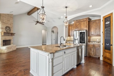 Discover the perfect blend of luxury & lifestyle in this on Pecan Plantation Country Club in Texas - for sale on GolfHomes.com, golf home, golf lot