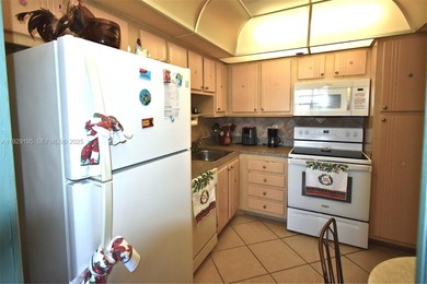 Enjoy easy and comfortable living in this bright 1-bedroom, 1 on Pembroke Lakes Golf Club in Florida - for sale on GolfHomes.com, golf home, golf lot