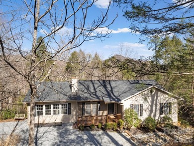 This recently renovated home with an open concept living space on Rumbling Bald Resort on Lake Lure in North Carolina - for sale on GolfHomes.com, golf home, golf lot