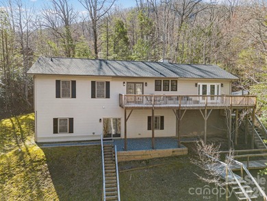This recently renovated home with an open concept living space on Rumbling Bald Resort on Lake Lure in North Carolina - for sale on GolfHomes.com, golf home, golf lot