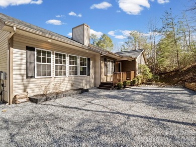 This recently renovated home with an open concept living space on Rumbling Bald Resort on Lake Lure in North Carolina - for sale on GolfHomes.com, golf home, golf lot