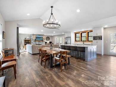 This recently renovated home with an open concept living space on Rumbling Bald Resort on Lake Lure in North Carolina - for sale on GolfHomes.com, golf home, golf lot