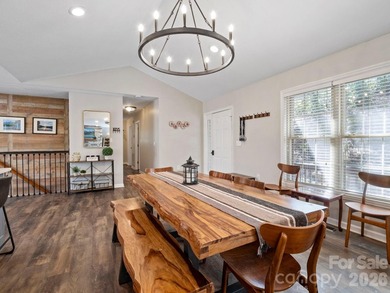 This recently renovated home with an open concept living space on Rumbling Bald Resort on Lake Lure in North Carolina - for sale on GolfHomes.com, golf home, golf lot