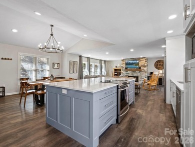 This recently renovated home with an open concept living space on Rumbling Bald Resort on Lake Lure in North Carolina - for sale on GolfHomes.com, golf home, golf lot