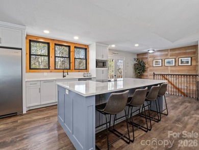 This recently renovated home with an open concept living space on Rumbling Bald Resort on Lake Lure in North Carolina - for sale on GolfHomes.com, golf home, golf lot