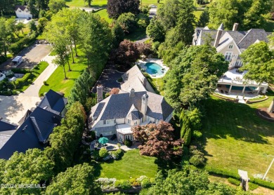 This stunning 5-bedroom, 5.5-bathroom English Tudor waterfront on Navesink Country Club in New Jersey - for sale on GolfHomes.com, golf home, golf lot