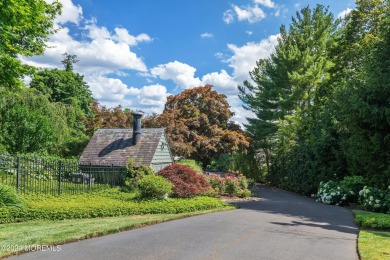 This stunning 5-bedroom, 5.5-bathroom English Tudor waterfront on Navesink Country Club in New Jersey - for sale on GolfHomes.com, golf home, golf lot