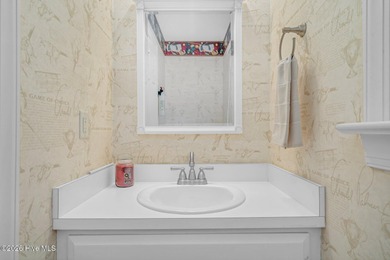 Set along the 13th green in The River subdivision of Lake Royale on River Golf and Country Club at Lake Royale in North Carolina - for sale on GolfHomes.com, golf home, golf lot