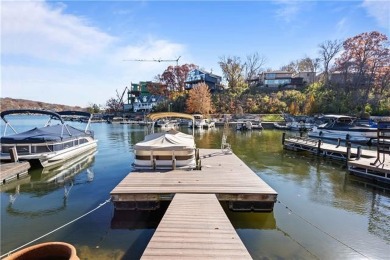 Nestled in the heart of Lake Quivira, this stunning home offers on Lake Quivira Country Club in Kansas - for sale on GolfHomes.com, golf home, golf lot
