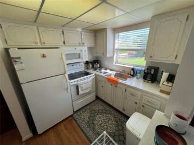 Come see it now! Corner 2nd floor 1 br/1.5 bth with CENTRAL A/C on Hillsboro Pines Golf in Florida - for sale on GolfHomes.com, golf home, golf lot