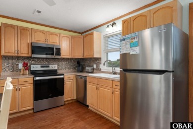 Welcome to your charming beach retreat in Nags Head, NC! This on Nags Head Golf Links in North Carolina - for sale on GolfHomes.com, golf home, golf lot