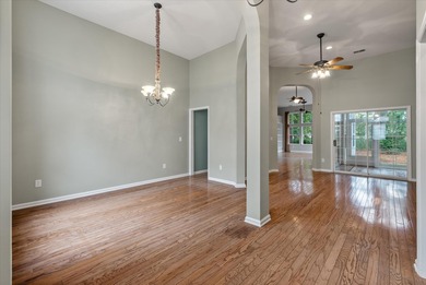 THIS PERFECT GOLF COURSE HOME is framed by majestic trees that on Legend Oaks Plantation Golf Club in South Carolina - for sale on GolfHomes.com, golf home, golf lot