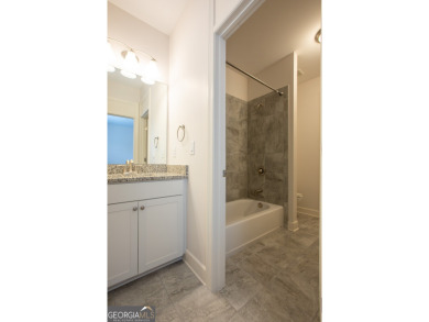 Enjoy the perfect balance of comfort and connection in this on Lanier Island Legacy Golf Couorse in Georgia - for sale on GolfHomes.com, golf home, golf lot