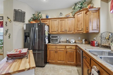 Welcome to 702 Copper Oaks Drive, a stunning 4-bedroom, 3-bath on Briarbrook Golf Course in Missouri - for sale on GolfHomes.com, golf home, golf lot
