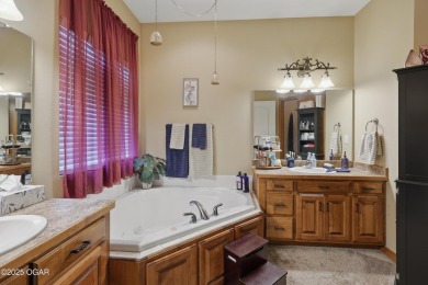 Welcome to 702 Copper Oaks Drive, a stunning 4-bedroom, 3-bath on Briarbrook Golf Course in Missouri - for sale on GolfHomes.com, golf home, golf lot