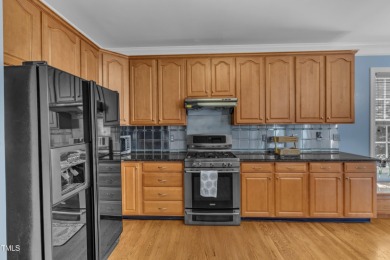 This stately, brick front home in popular Brier Creek golf on Brier Creek Country Club in North Carolina - for sale on GolfHomes.com, golf home, golf lot