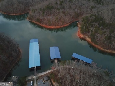 Enjoy the perfect balance of comfort and connection in this on Lanier Island Legacy Golf Couorse in Georgia - for sale on GolfHomes.com, golf home, golf lot