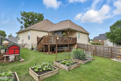 Welcome to 702 Copper Oaks Drive, a stunning 4-bedroom, 3-bath on Briarbrook Golf Course in Missouri - for sale on GolfHomes.com, golf home, golf lot