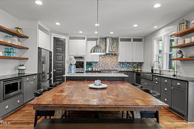 This stunning 7-bedroom, 6-bathroom custom-crafted home located on The Club At Twelve Oaks in North Carolina - for sale on GolfHomes.com, golf home, golf lot