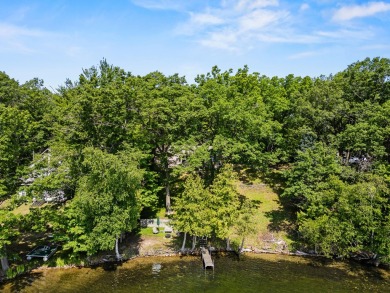 This beautiful Lake Mecosta property features 137 feet of nice on St. Ives Golf Club in Michigan - for sale on GolfHomes.com, golf home, golf lot