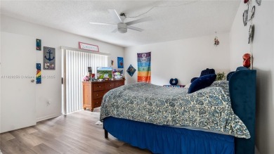 Discover this charming townhouse with 3 spacious bedrooms and 3 on Pine Island Ridge Country Club in Florida - for sale on GolfHomes.com, golf home, golf lot