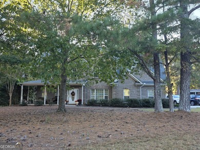 Beautiful 4 sided brick two story home on level corner lot in on Canongate At Georgia National Golf Club in Georgia - for sale on GolfHomes.com, golf home, golf lot