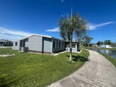 Lovely two-bedroom two bath home with lake views.  This home on Lake Fairways Country Club in Florida - for sale on GolfHomes.com, golf home, golf lot