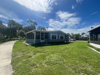 Lovely two-bedroom two bath home with lake views.  This home on Lake Fairways Country Club in Florida - for sale on GolfHomes.com, golf home, golf lot