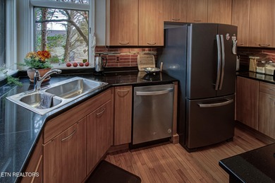 You enter this lovely home through its handsome double doors and on Tanasi Golf Course in Tennessee - for sale on GolfHomes.com, golf home, golf lot