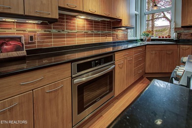 You enter this lovely home through its handsome double doors and on Tanasi Golf Course in Tennessee - for sale on GolfHomes.com, golf home, golf lot