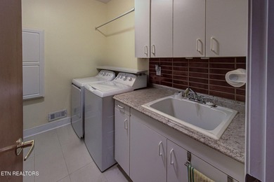 You enter this lovely home through its handsome double doors and on Tanasi Golf Course in Tennessee - for sale on GolfHomes.com, golf home, golf lot