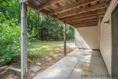 Don't miss this opportunity to own a well-maintained property on on Grand Haven Golf Club in Michigan - for sale on GolfHomes.com, golf home, golf lot