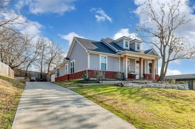 Adorable single story home, with excellent curb appeal located on Eagle Mountain Country Club  in Texas - for sale on GolfHomes.com, golf home, golf lot