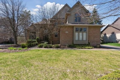 Step into this stunning 4-bedroom brick colonial located in the on Oakhurst Golf and Country Club in Michigan - for sale on GolfHomes.com, golf home, golf lot