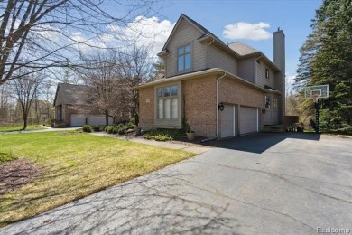 Step into this stunning 4-bedroom brick colonial located in the on Oakhurst Golf and Country Club in Michigan - for sale on GolfHomes.com, golf home, golf lot